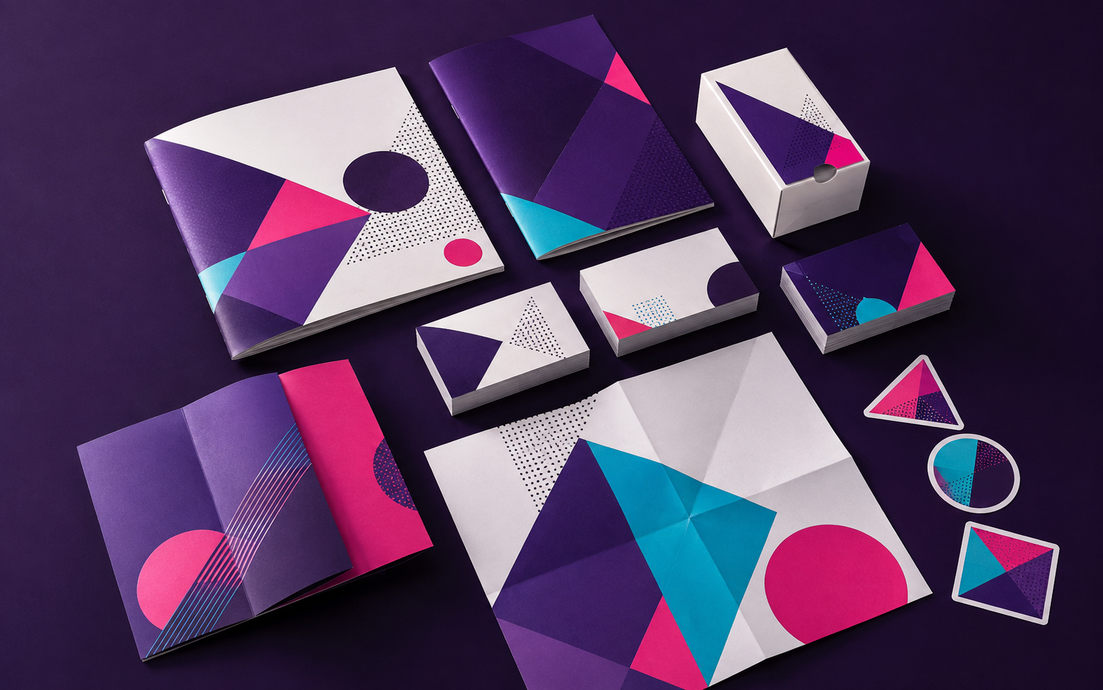 Illustrative purple, cyan and magenta print collection with brochures, business cards, labels and packaging